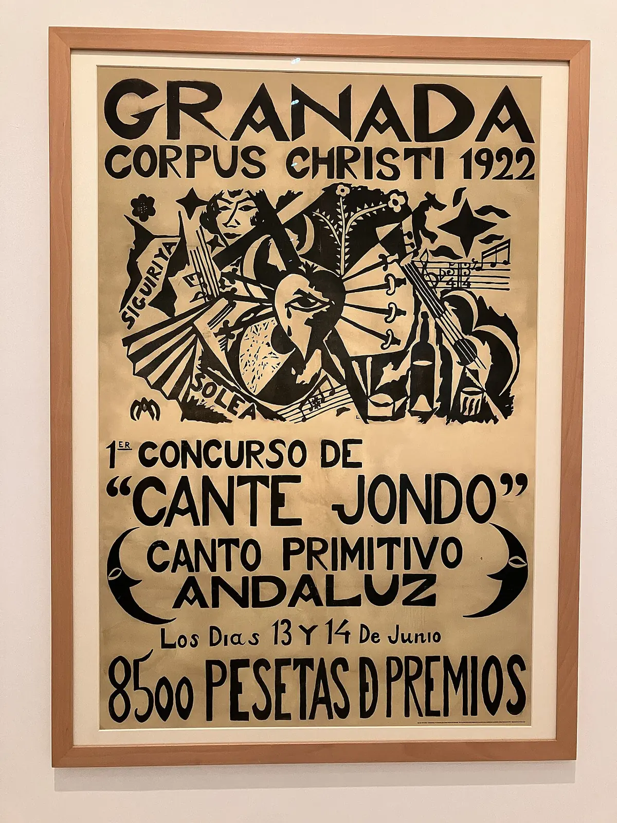 Zarámovaný plakát s nápisem Granada, Corpus Christi 1922, 1st Concurso de Cante Jondo, canto primitivo andaluz